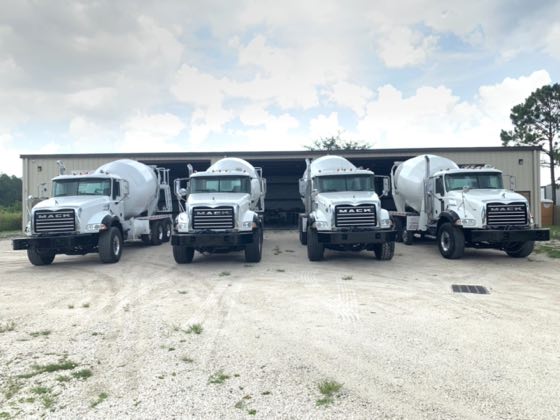 Reconditioned concrete mixer trucks lined up on the SuperMixers yard in Orlando